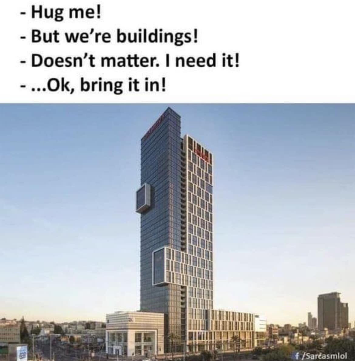 This wholesome meme features a short anthropomorphic dialogue between two buildings at the top, paired with a photograph of two adjacent skyscrapers whose architectural design accidentally looks exactly like they are hugging. The dialogue reads: '- Hug me! - But we're buildings! - Doesn't matter. I need it! - ...Ok, bring it in!'. The protruding sections of the two skyscrapers fit together perfectly to resemble an embrace, which creates the visual joke matching the text.