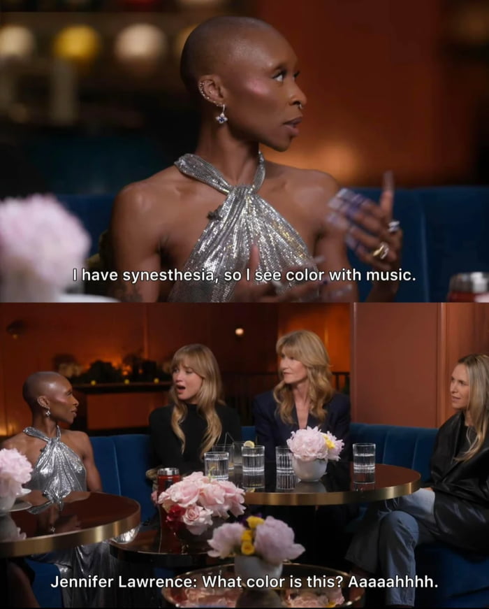 This is a two-panel screenshot meme from a celebrity roundtable interview. The top panel features Cynthia Erivo explaining that she has synesthesia, a neurological condition where senses overlap, so she sees colors when she experiences music, with on-screen text reading "I have synesthesia, so I see color with music.". The bottom panel shows the full group at the interview table, with Jennifer Lawrence reacting with an exaggerated, playful shocked confused reaction, captioned "Jennifer Lawrence: What color is this? Aaaaaahhhh.". The joke comes from Jennifer's over-the-top, unfiltered amused reaction to the unusual neurodivergent condition.