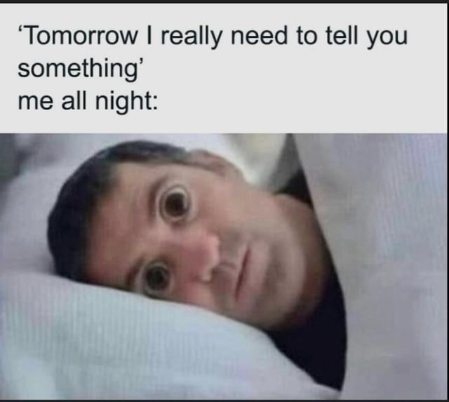 A two-panel meme consisting of a top text panel and a bottom image panel. The top panel contains the text: 'Tomorrow I really need to tell you something' me all night: which sets up the scenario of someone mentioning an unresolved statement. The bottom panel shows a real person lying in bed, covered by a light-colored blanket, with wide, anxious eyes and a tense expression, visually representing the inability to sleep due to overthinking the pending message. The meme humorously captures the relatable experience of losing sleep over unresolved or ambiguous statements from others.