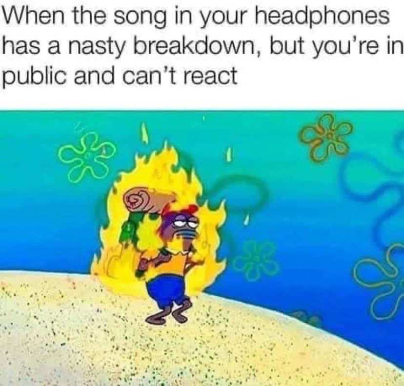 This is a single-panel reaction meme. The top of the image displays relatable text describing the scenario where a song playing on your headphones has an exciting, heavy breakdown, but you cannot react outwardly because you are in a public space. Below the text is a scene from the animated show SpongeBob SquarePants: an unnamed background fish character is entirely wrapped in bright yellow flames, but wears a completely neutral, deadpan expression and walks calmly as if nothing unusual is happening, visually representing the contrast between intense internal excitement and forced external composure in the described situation.