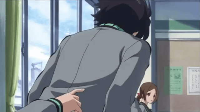 An animated scene set in a classroom environment featuring two characters. The background includes large windows with green curtains revealing a blue sky with clouds, and a bulletin board with papers pinned to it. One character, with black hair, is viewed from the back wearing a gray school uniform with a green collar. The second character has brown hair tied in a ponytail and is looking up at the first character, also in a school uniform.