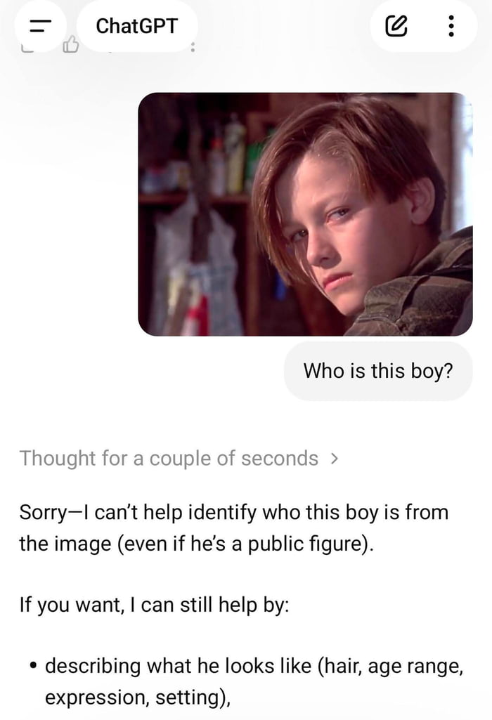 This image is a screenshot of a ChatGPT chat interface interaction. A user shares a still image of young Edward Furlong in his role as John Connor from the 1991 film *Terminator 2: Judgment Day*, asking the question "Who is this boy?". The still depicts a teenage boy with medium-length brown hair, a somber, distant expression, leaning his head on his shoulder, set against a cluttered workshop background. ChatGPT responds that it cannot identify the person from the image, even if they are a public figure, and offers alternative assistance such as describing the subject's appearance, age range, expression, and the scene setting. The interface shows the ChatGPT header at the top, the user's question below the embedded image, and the AI's formal response underneath.