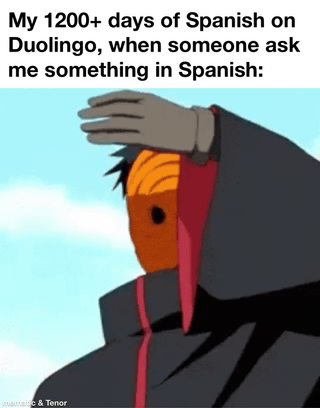 A multi-frame meme featuring a scene from the anime 'Naruto' with an overlay text. The top text in each frame reads: 'My 1200+ days of Spanish on Duolingo, when someone ask me something in Spanish:'. The visual shows a member of the Akatsuki organization (character in a black cloak with red cloud patterns) standing on a grassy hill, then jumping and falling off the hill, growing smaller as they descend, and finally a close-up of their distressed face. The humor lies in the relatable contrast between the long duration of studying Spanish on Duolingo (1200+ days) and the inability to respond when actually asked, symbolized by the character's dramatic fall representing panic or failure to apply learned skills.