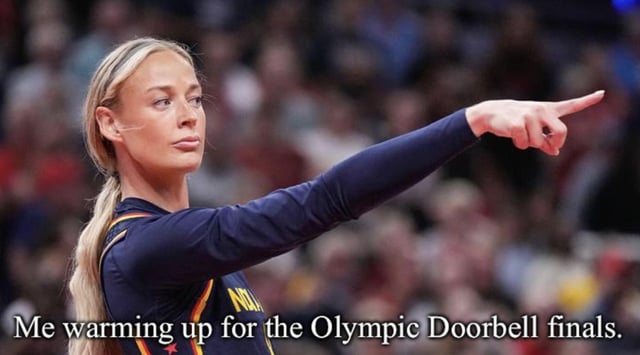 This is an absurdist relatable meme that uses a photograph of a blonde female professional athlete in a dark long-sleeved competition uniform standing in front of a blurred sports arena audience. The athlete has a serious, intensely focused expression, and extends her right arm to point firmly with her index finger towards the right side of the frame. White text is overlaid at the bottom of the image that reads 'Me warming up for the Olympic Doorbell finals.' The joke relies on the absurd contrast between the athlete's high-stakes, intense competitive pre-event pose and the completely trivial, made-up 'Olympic Doorbell' event, as the pointing gesture perfectly mimics the motion of pressing a doorbell.
