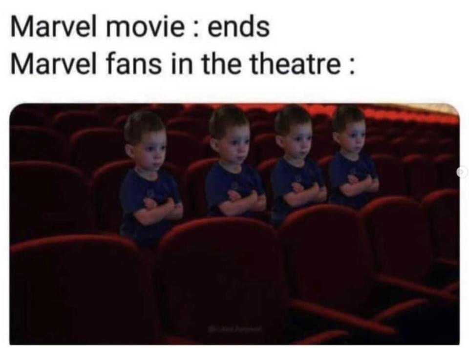 The meme consists of two lines of text at the top, followed by an edited photograph. The top text reads 'Marvel movie : ends' and 'Marvel fans in the theatre :'. The image below shows four identical copies of a young boy sitting in red theater seats, all with arms crossed and a serious, expectant expression looking forward. The joke references the widely known convention of Marvel Cinematic Universe films including one or more post-credits scenes, so dedicated fans remain in their seats even after the main feature concludes, waiting for the extra content.