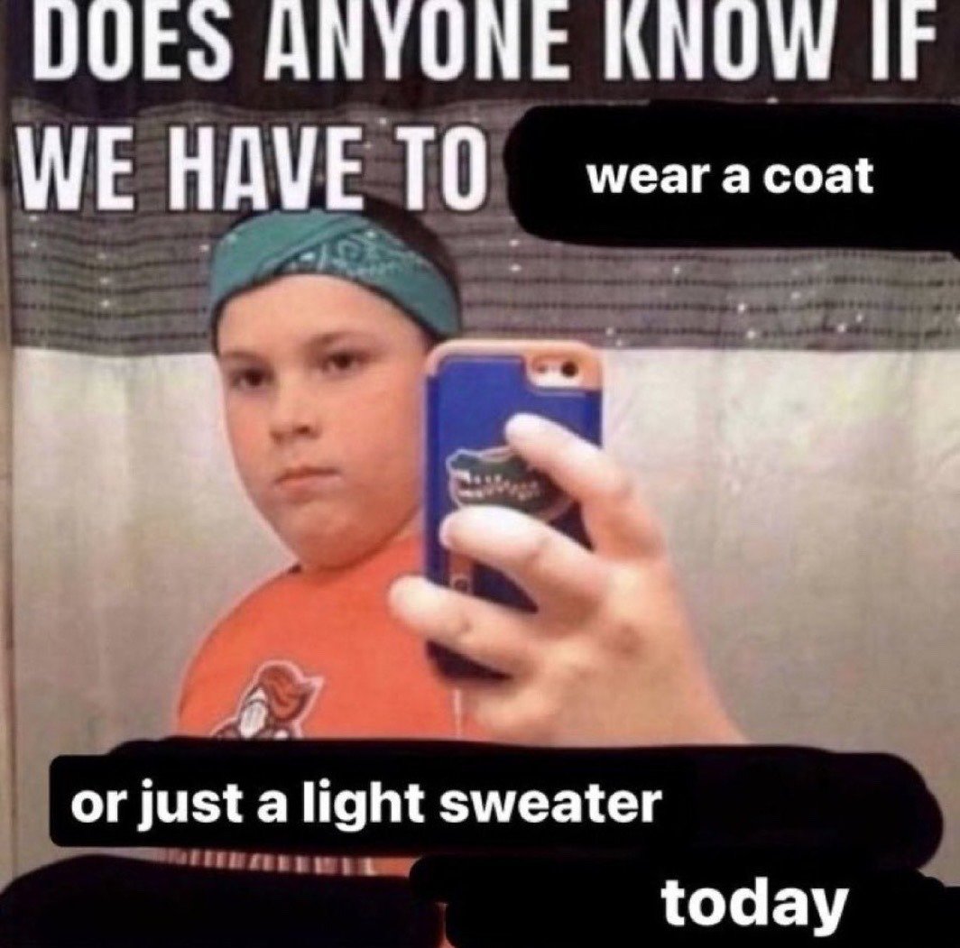 The meme uses a well-known viral shot of a pre-teen boy taking a deadpan mirror selfie. He wears a teal bandana on his head and an orange graphic t-shirt, holding a blue iPhone with a Florida Gators logo case out in front of him to take the photo, standing in front of a patterned shower curtain. Overlaid text splits a common relatable question across the top, middle, and bottom of the frame: 'DOES ANYONE KNOW IF WE HAVE TO wear a coat or just a light sweater today', referencing the widespread struggle of deciding what outerwear to wear when daily weather is unpredictable and inconsistent.