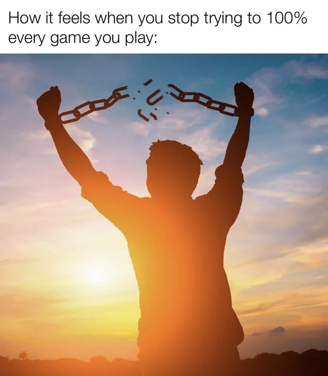 A meme image depicting a silhouette of a person standing against a vibrant sunset, raising their arms to break a metal chain above their head. The top text reads 'How it feels when you stop trying to 100% every game you play:', framing the visual metaphor of liberation from the stress of completing games fully. The warm sunset colors and the act of breaking the chain symbolize relief and freedom from the pressure of perfectionism in gaming.