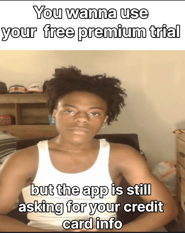 This is a single-panel reaction meme. The top text reads 'You wanna use your free premium trial', while the bottom text reads 'but the app is still asking for your credit card info'. The central visual is a young Black man with curly hair wearing a white tank top, looking at the camera with a deadpan, unimpressed, annoyed expression that perfectly conveys the relatable frustration of encountering a mandatory credit card info requirement when attempting to claim a supposedly free service trial, where users often fear being automatically charged once the trial ends if they forget to cancel.