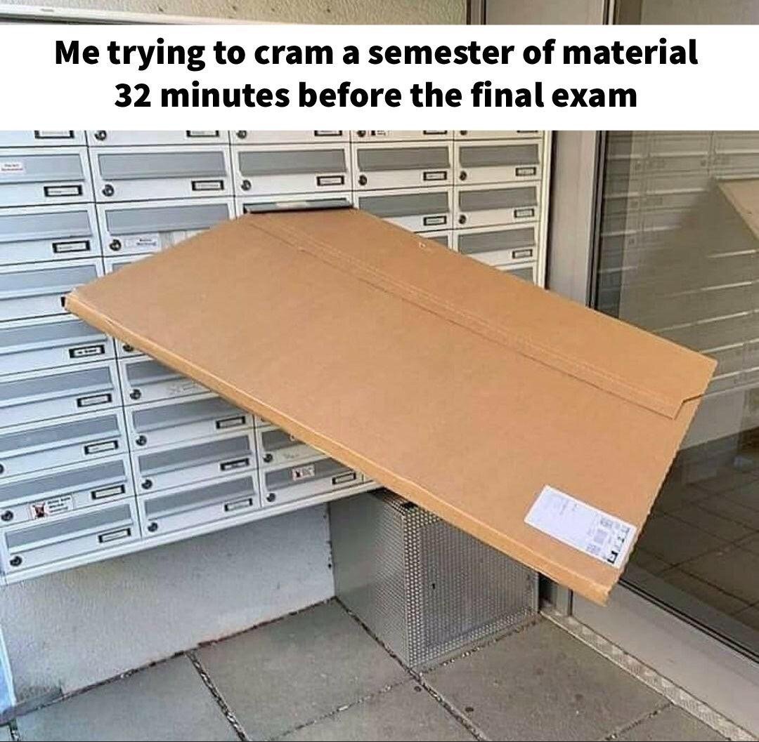 The meme consists of a top text caption paired with a photograph of an extremely large, flat cardboard package awkwardly wedged partially into a small apartment building mailbox slot, with most of the package sticking out as it is far too large to fit inside. The joke draws a relatable comparison between the absurd, impossible act of forcing an oversized package into a tiny mailbox, to the common student experience of trying to memorize an entire semester's worth of academic material in only 32 minutes right before a final exam, mocking typical student procrastination habits.