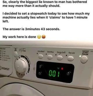 This meme features blocks of text on top of a photograph of an Indesit brand washing machine control panel. The control panel's digital display shows a green '001', meaning the wash cycle is marked as having 1 minute remaining. The upper text explains the creator was frustrated by the common, widely reported issue where laundry appliances take far longer to finish than the final 1 minute their display claims is left. The creator tested this by timing the cycle when it hit the 1 minute mark, and found this final '1 minute' actually lasted 3 minutes and 43 seconds. The text ends with the line 'My work here is done' paired with a weary face emoji and a saluting face emoji, implying the creator has successfully proven a long-suspected truth about inaccurate appliance timers. The humor relies on relatable everyday frustration with unreliable device estimated completion times.