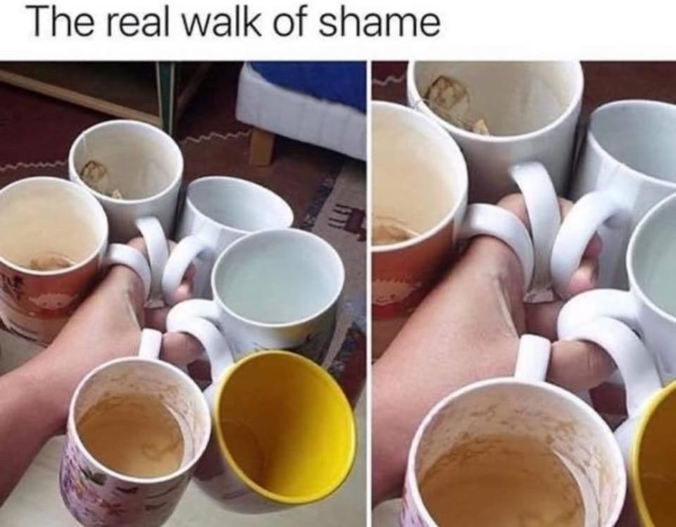 This is a two-panel relatable humor meme. The text at the top reads 'The real walk of shame'. Both panels show a close-up of a person's hand holding the handles of 6+ used, dirty mugs between their fingers to carry all of them at once. The mugs have leftover drink residue, old used teabags, or remnants of coffee/tea inside, indicating they were left scattered around the home for an extended period. The joke redefines the common term 'walk of shame' (traditionally referring to the embarrassed trip home after a casual one-night stand) to instead describe the relatable, awkward feeling of carrying a large pile of neglected dirty cups you accumulated to finally wash them.