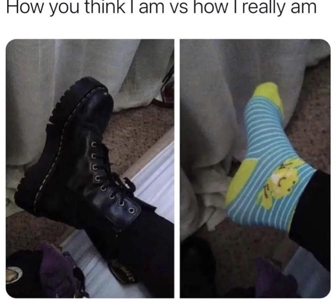 This is a two-panel side-by-side comparison meme. The top text across the image reads 'How you think I am vs how I really am'. The left panel displays a person wearing a chunky, rugged black platform combat boot, representing the tough, edgy, intimidating perception other people have of the person. The right panel shows the same foot with the boot removed, revealing a soft, playful light blue striped sock with yellow trim and a smiling yellow cartoon character print, representing the person's actual gentle, silly inner personality. The humor comes from the relatable contrast between the outward alternative aesthetic and the much softer, less intimidating true personality underneath, a common experience for people who dress in punk, goth, or alt fashion styles.
