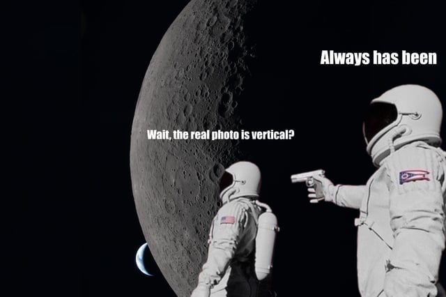 This is a meta variation of the classic 'Always Has Been' two-astronaut meme format. The scene is set in outer space, with a large crescent moon that is cropped horizontally by the image's frame. One astronaut facing the moon asks the question 'Wait, the real photo is vertical?', referencing that the original high-resolution viral Moon image is a vertical full image, while this meme's horizontal crop cuts it off. A second astronaut standing to the right points a handgun at the first astronaut and delivers the iconic punchline 'Always has been'. The joke is a meta twist playing on the orientation of the viral Moon image and the structure of the meme itself.