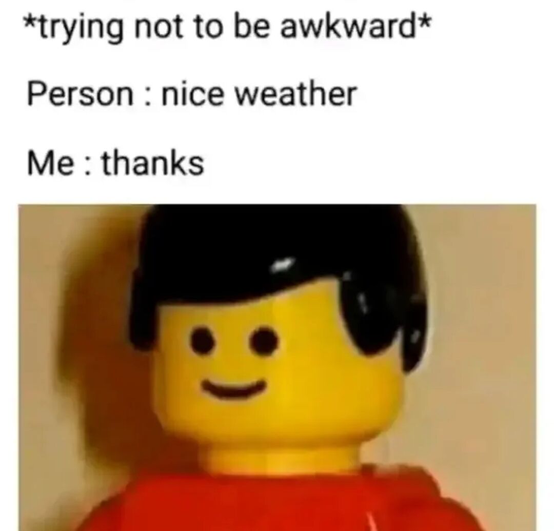 This is a relatable humorous meme consisting of text positioned above a photo of a classic yellow Lego minifigure with a blank, forced smile, black hair, and a red shirt. The text lays out a common awkward social scenario: the narrator is actively trying to avoid being awkward during a casual interaction, when another person makes small talk by saying 'nice weather'. The narrator accidentally gives an illogical, awkward response of 'thanks', and the smiling Lego minifigure perfectly illustrates the strained, cringey internal feeling after making the embarrassing social misstep.