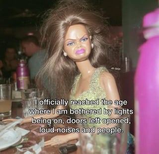 This is a relatable meme featuring a photograph of a frowning, messy-haired Barbie doll seated at a restaurant table. Overlaid on the image is text that reads 'I officially reached the age where I am bothered by lights being on, doors left opened, loud noises and people.' The joke plays on the common experience of becoming more introverted and easily irritated by minor everyday inconveniences as one ages, with the original poster noting this feeling already hits in early 20s. The doll's grumpy expression perfectly matches the annoyed sentiment of the text.