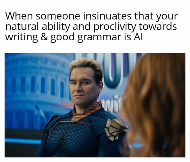 The meme consists of a top text overlay and a screenshot from the TV series 'The Boys'. The top text reads: 'When someone insinuates that your natural ability and proclivity towards writing & good grammar is AI'. Below the text is an image of the character Homelander (played by Antony Starr), a blonde male in a blue superhero costume with gold accents, standing in front of a background featuring the U.S. Capitol building. Homelander has a serious, slightly annoyed expression and is facing a red-haired person whose back is to the viewer. The meme humorously uses Homelander's stern reaction to convey frustration or disbelief at being accused of using AI for natural writing abilities.