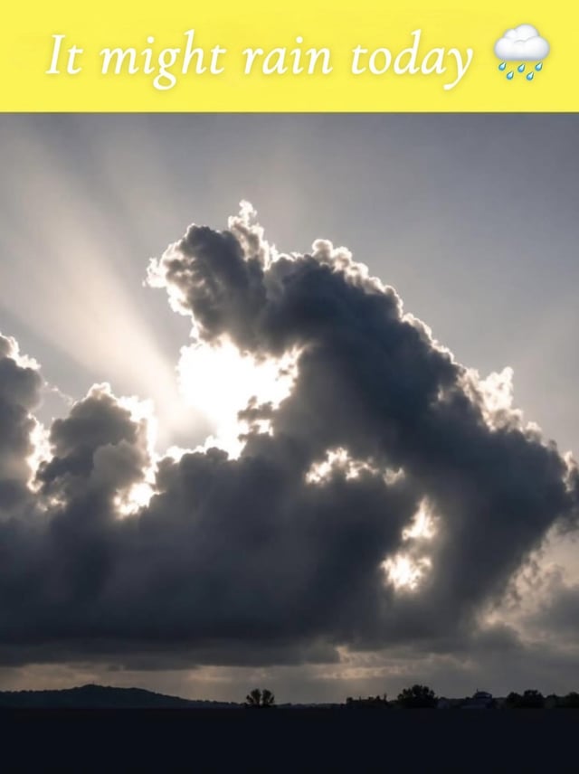 The meme is split into two sections: a bright yellow top banner and a landscape photograph below. The top banner contains white serif text reading 'It might rain today' next to an emoji of a cloud raining blue raindrops. The lower section shows a sky filled with dark storm clouds, with bright sun rays breaking through from behind the cloud formations. The large central cloud is coincidentally shaped exactly like a standing human figure urinating downwards, creating a crude visual pun where the cloud's implied 'urine' is framed as the forecasted rain.