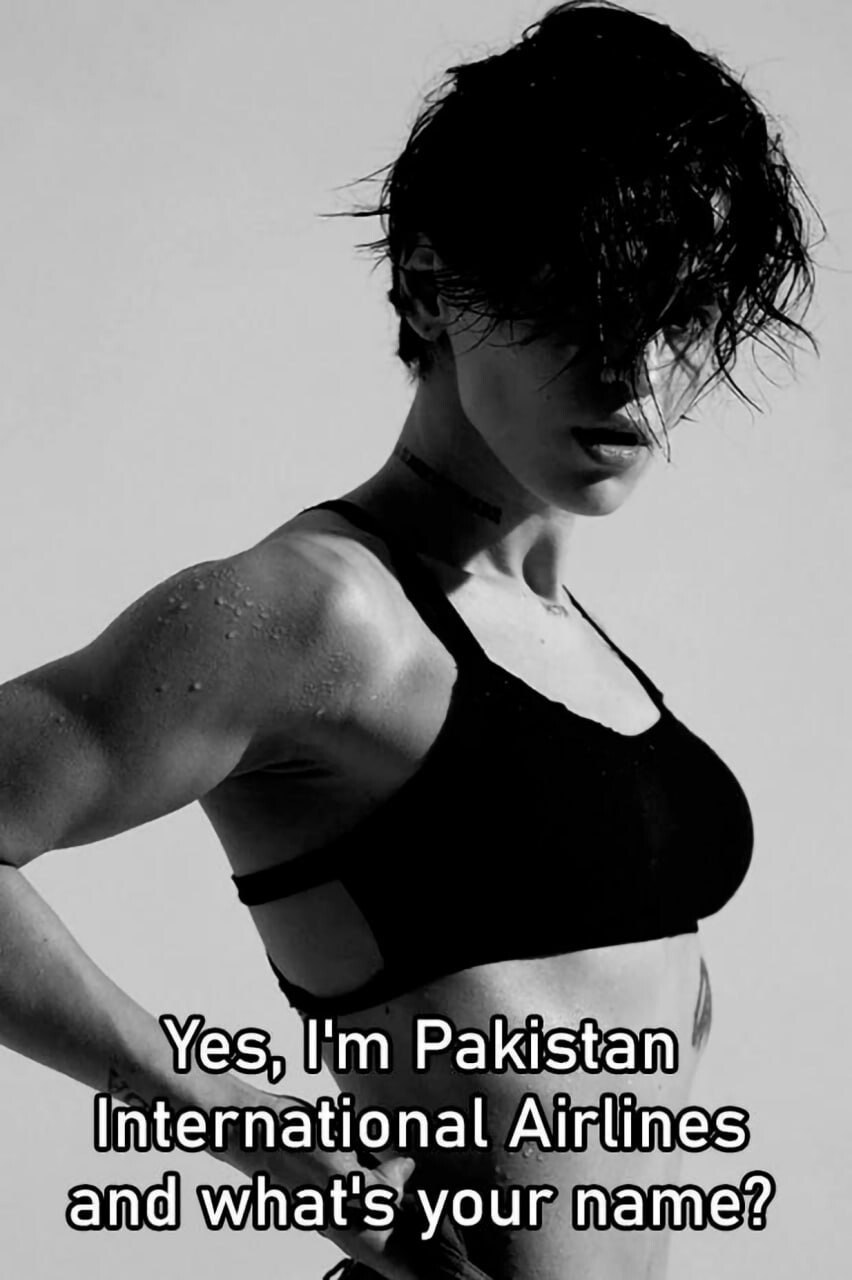 A black and white photograph featuring a muscular individual wearing a black sports bra, with water droplets visible on their shoulder and wet hair partially covering their face. The person is posed with one hand on their hip, exuding a confident and mysterious demeanor. At the bottom of the image, bold white text reads: 'Yes, I'm Pakistan International Airlines and what's your name?'