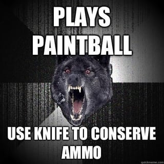 A meme featuring an aggressive black wolf head with bared teeth and red eyes against a dark, textured background. The top text reads 'PLAYS PAINTBALL' in bold white capital letters, and the bottom text reads 'USE KNIFE TO CONSERVE AMMO'. The humor stems from the absurd contrast between the wolf's ferocity and the casual context of paintball, where using a knife is unnecessary and over-the-top for conserving ammunition.