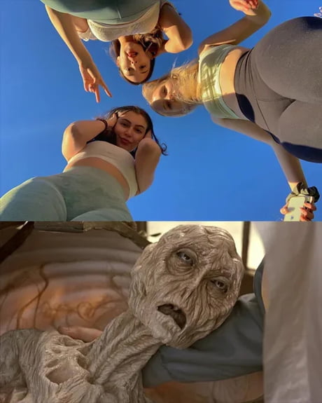 The image is a two-part collage. The top section features three women in casual athletic wear (crop tops and leggings) posing cheerfully against a clear blue sky, with relaxed smiles and raised arms. The bottom section depicts a grotesque, emaciated creature with sunken eyes, wrinkled grayish skin, and a distorted, horrified expression, lying in a seemingly痛苦 state, likely from a horror film or game. The stark contrast between the mundane, wholesome top half and the terrifying, otherworldly bottom half creates a surreal and unsettling effect.