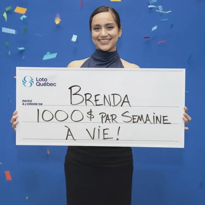 A photograph of a woman named Brenda standing against a blue background with falling confetti, celebrating a lottery win. She is holding a large white check from Loto Quebec. The check is made out to Brenda and states '1000$ PAR SEMAINE À VIE!' (1000$ per week for life). Brenda is smiling, wearing a dark blue halter top and black skirt, and the celebratory confetti adds to the joyful atmosphere.
