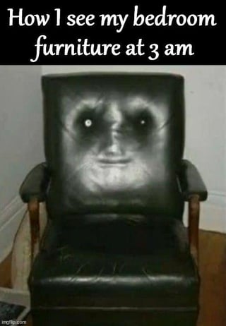 N/A (shadow pattern on armchair)
